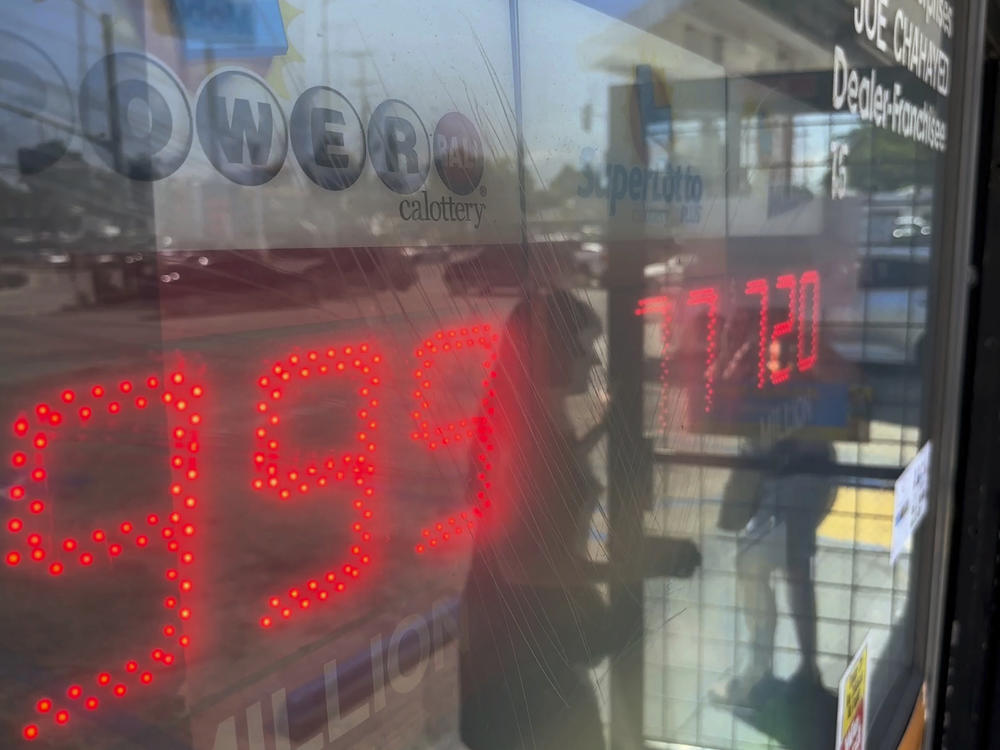 People buy Powerball tickets at Joe's Service Center, a Mobil gas station that previously sold the $2.04 billion-winning Powerball ticket at Woodbury Road and Fair Oaks Avenue in Altadena, Calif., Wednesday, July 19, 2023.
