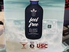 The counter at Glass Chamber smoke shop in West Palm Beach, Fla., features an ad for Feel Free, a tonic sponsored by the athletic departments of the University of Texas, Florida State University and the University of Southern California. The ad doesn't mention that Feel Free contains kratom, a controversial herb linked to fatal overdoses.