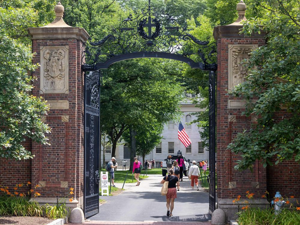 CAMBRIDGE, MASSACHUSETTS - JUNE 29: People walk through the gate on Harvard Yard at the Harvard University campus on June 29, 2023 in Cambridge, Massachusetts.
