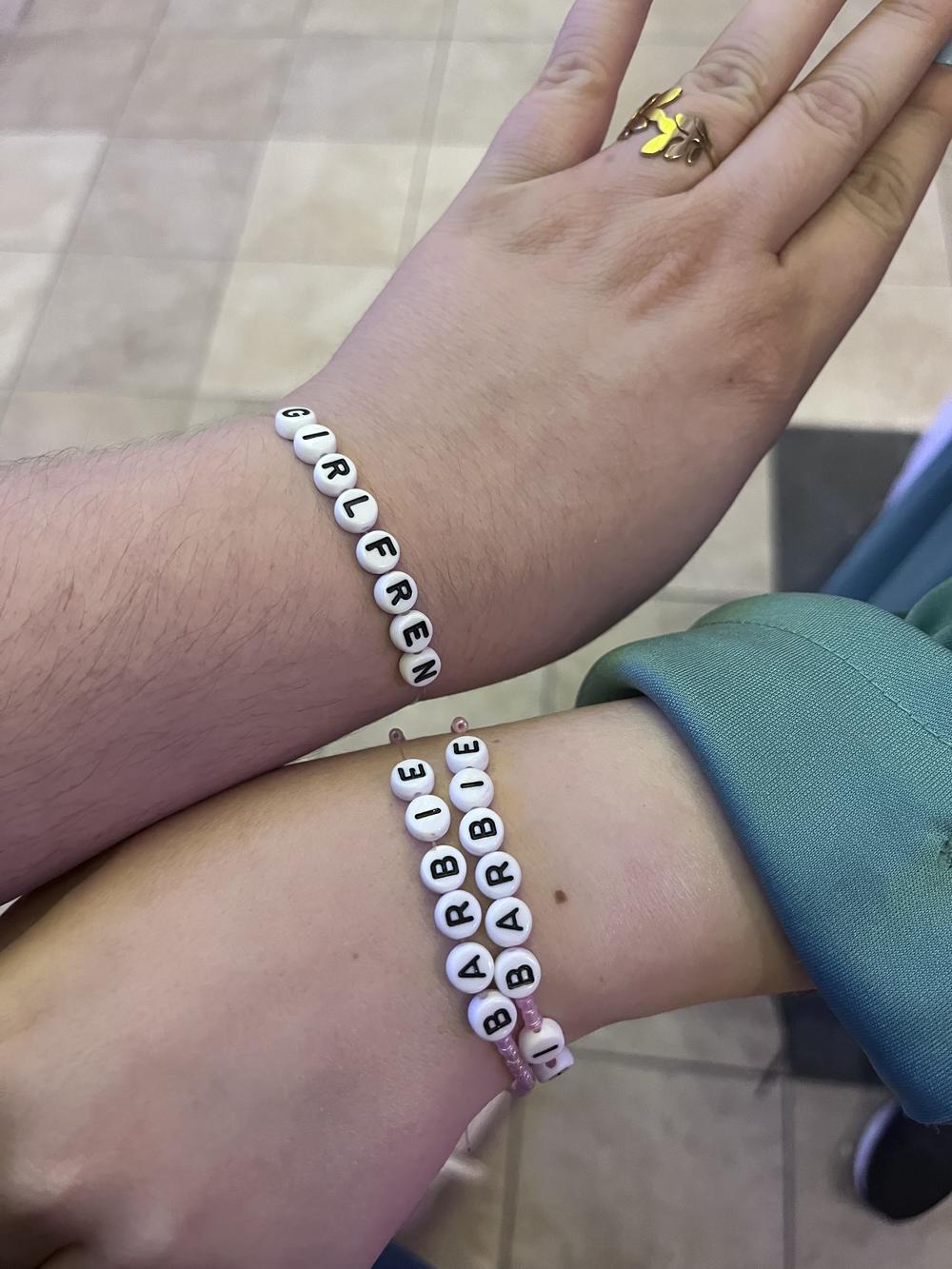 Mishaela Robison and Margaret Murphy made <em></em>Barbenheimer-themed friendship bracelets to give out at the theater in a nod to another cultural phenomenon, Taylor Swift's Eras Tour.