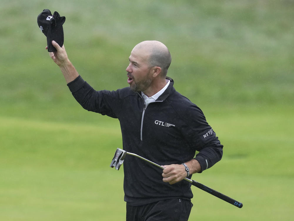 Brian Harman celebrates on the 18th green after winning the British Open Golf Championships at the Royal Liverpool Golf Club in Hoylake, England, on Sunday.