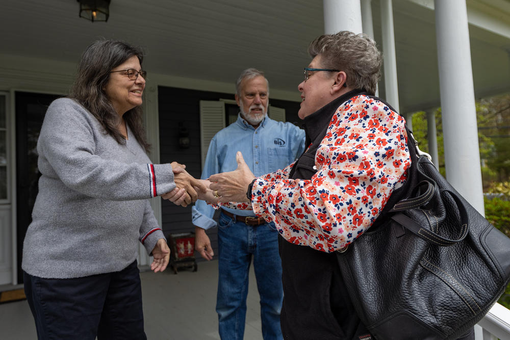 Jan Rohwetter greets Donna Savastio and John Shambroom at their house. Rohwetter shared that she lost her mom recently after a long bout with dementia. 