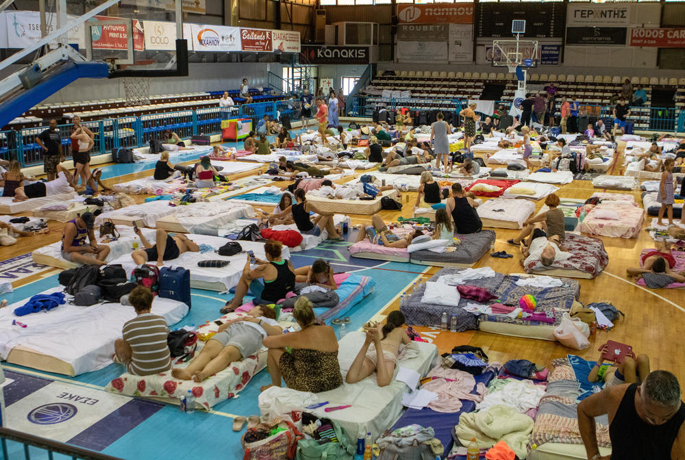 July 23, 2023: Evacuees take shelter at a sports hall in Venetokleio due to wildfires on Rhodes island, Greece.
