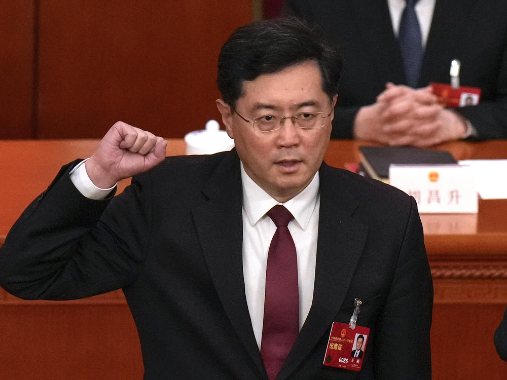 Qin Gang takes the oath as Chinese foreign minister during a session of China's National People's Congress at the Great Hall of the People in Beijing on March 12. China removed Qin from the post and replaced him with his predecessor, Wang Yi, in a move that has already fueled rumors over the personal lives and political rivalries of China's Communist Party elite.