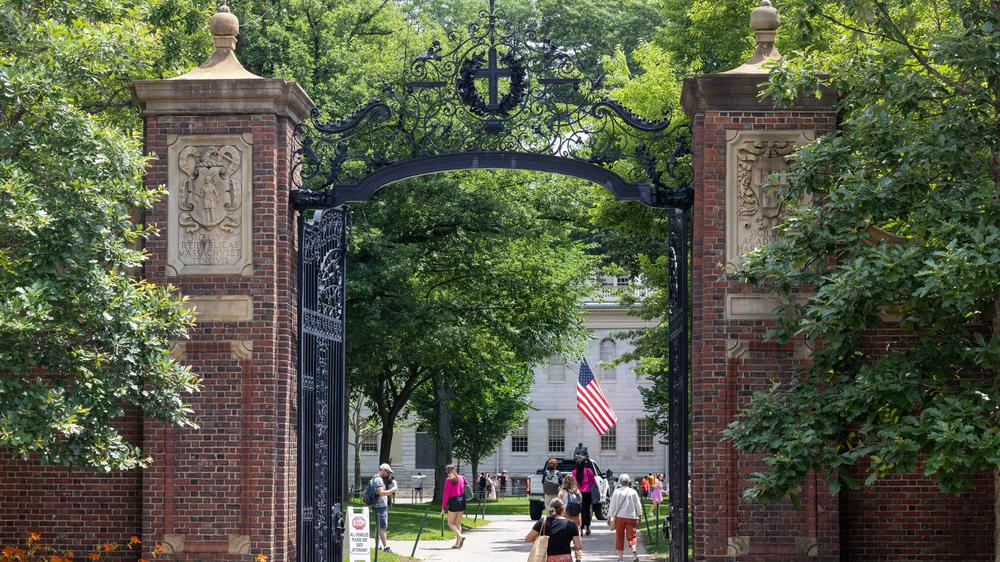 CAMBRIDGE, MASSACHUSETTS - JUNE 29: People walk through the gate on Harvard Yard at the Harvard University campus on June 29, 2023 in Cambridge, Massachusetts.