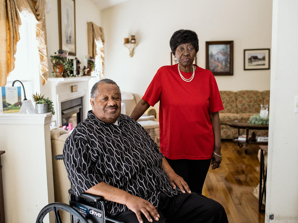 Thomas Greene with his wife, Bluizer, at their home in Oxford, Pennsylvania. After Thomas had a procedure on his leg, the anesthesia providers billed Medicare late, and he was sent to collections for the debt.