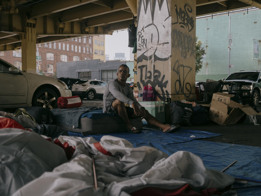 Jose Alvarado, an asylum seeker who arrived in New York City from Venezuela, sits at his camp. Alvarado says he was expelled from the Clinton Hill shelter due to an incident in the facility bathrooms. Brooklyn, New York, U.S., Wednesday, July 19, 2023.