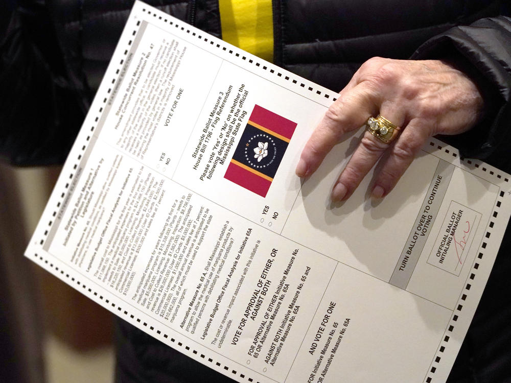 A voter holds a ballot on Election Day in Ridgeland, Miss., on Nov. 3, 2020.