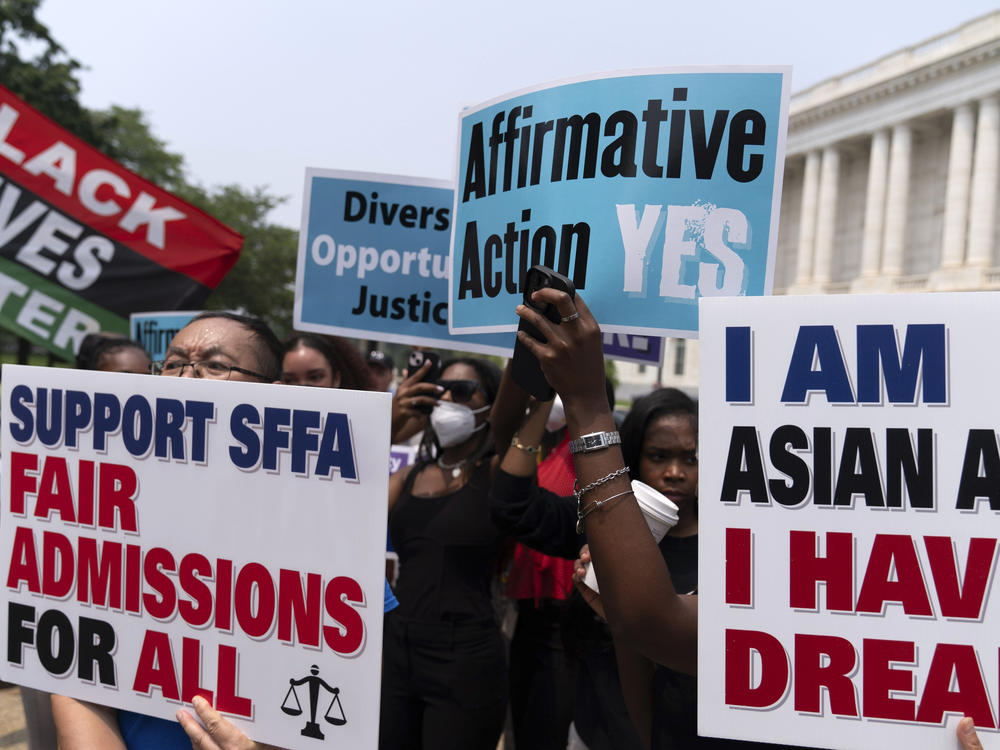 Demonstrators protest outside the Supreme Court in Washington on June 29, 2023, after the court struck down affirmative action in college admissions. Activists say they will sue Harvard over its use of legacy preferences for children of alumni.