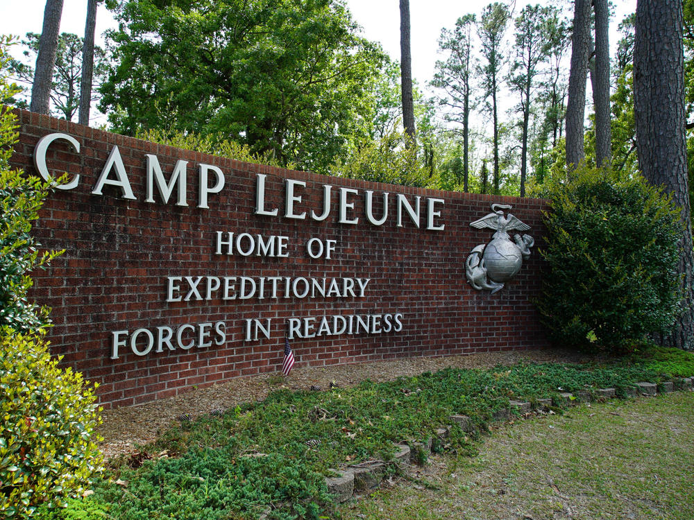 Signage stands on the main gate to Camp Lejeune Marine Base outside Jacksonville, N.C., Friday, April 29, 2022.