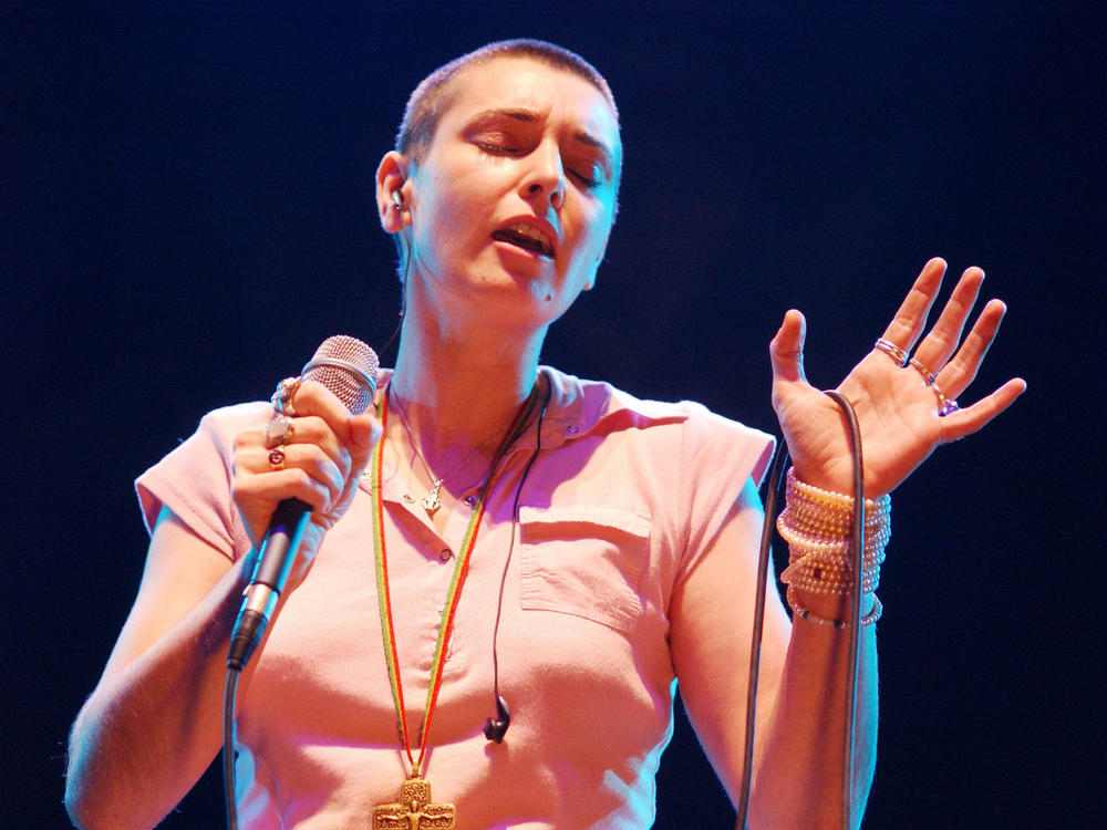 Sinéad O'Connor sings in concert in 2003 at The Point Theatre in Dublin, Ireland. O'Connor has died at 56.