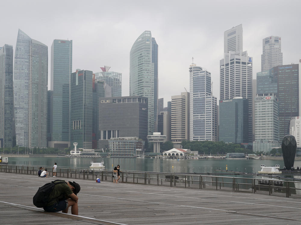 A man takes a nap as the central business district is shrouded by haze in Singapore, on Sept. 23, 2019. Singapore executed a man Wednesday, July 26, 2023, for drug trafficking and is set to hang a woman Friday — the first in 19 years — prompting renewed calls for a halt to capital punishment.