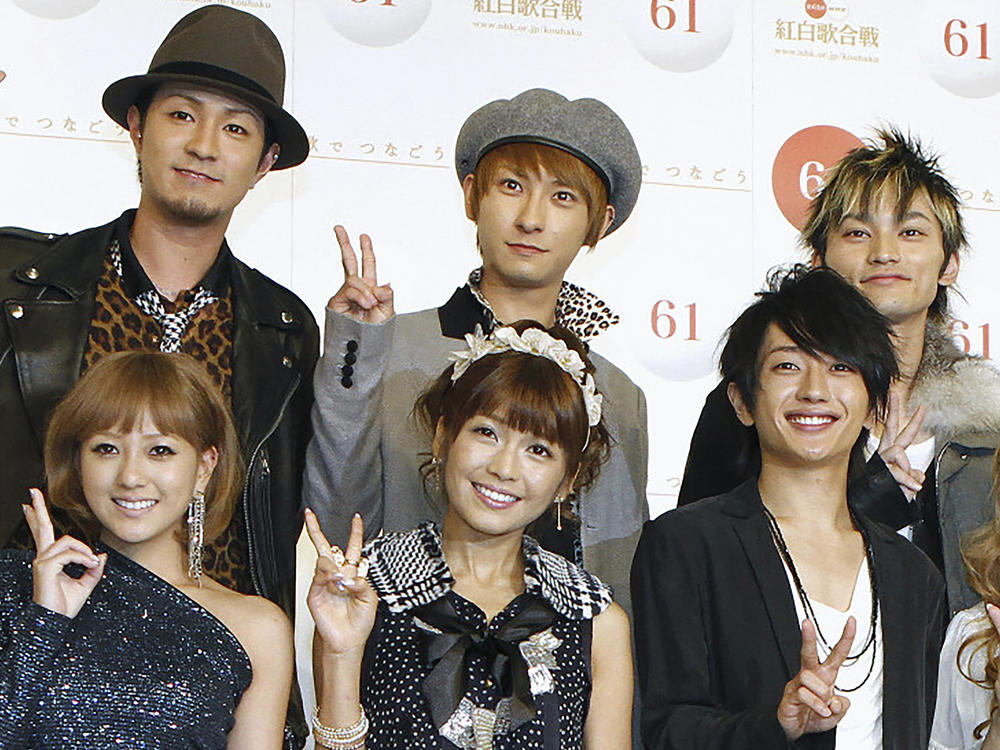 Japanese pop star Shijiro Atae, rear center, poses with others during an announcement for a year-end TV music show in Tokyo on Nov. 24, 2010. Atae said he is gay in an emotional announcement at a fan event Wednesday, July 26, 2023, that was warmly welcomed in a country where the government does not recognize LGBTQ equality. (Kyodo News via AP)