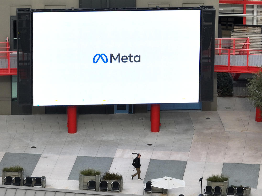 A large video monitor on the campus of Meta, Facebook's parent company, in Menlo Park, Calif. in February. New research about Facebook shows its impact on political polarization.
