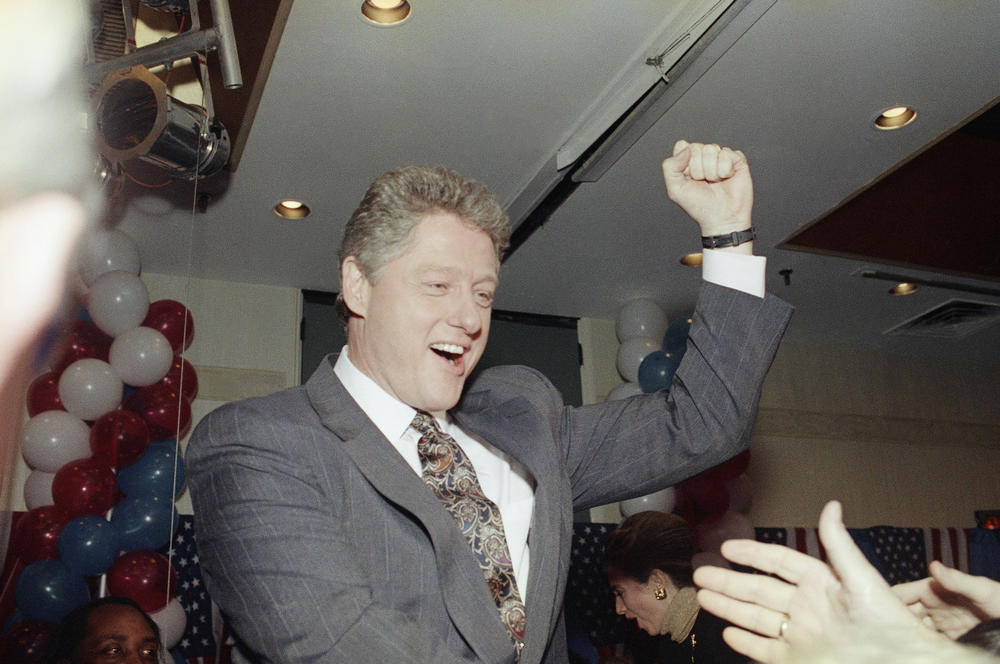 Democratic presidential hopeful Bill Clinton of Arkansas raises his fist for the crowd before speaking to supporters at a campaign party at the Merrimack Inn in Merrimack, N.H., on Feb. 18, 1992.