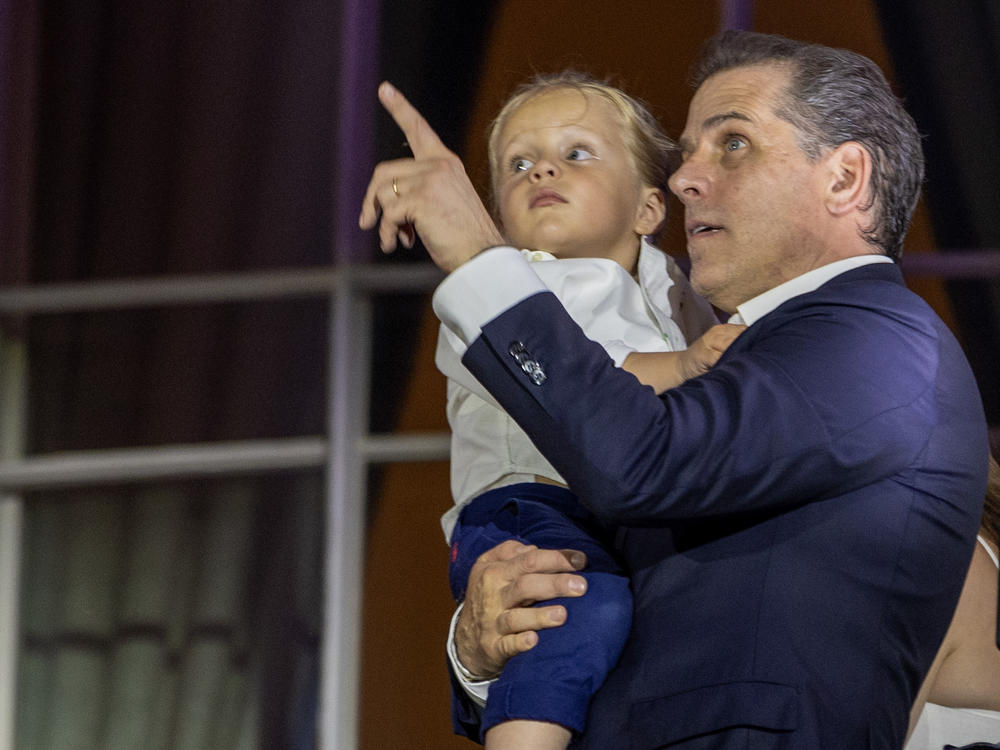 Hunter Biden, holding Beau Biden, watches fireworks on the South Lawn of the White House on July 04, 2023 in Washington, D.C.