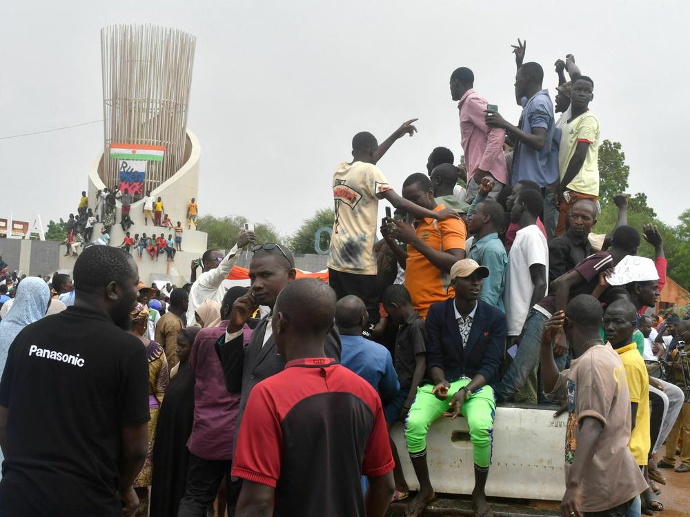 Supporters of the Nigerien defence and security forces gather during a demonstration outside the national assembly in Niamey on July 27, 2023.