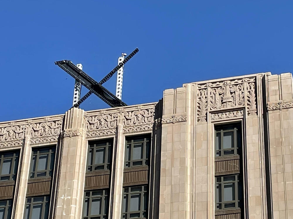The new X sign is installed Friday on the roof of the San Francisco headquarters of Twitter, which is being rebranded as 