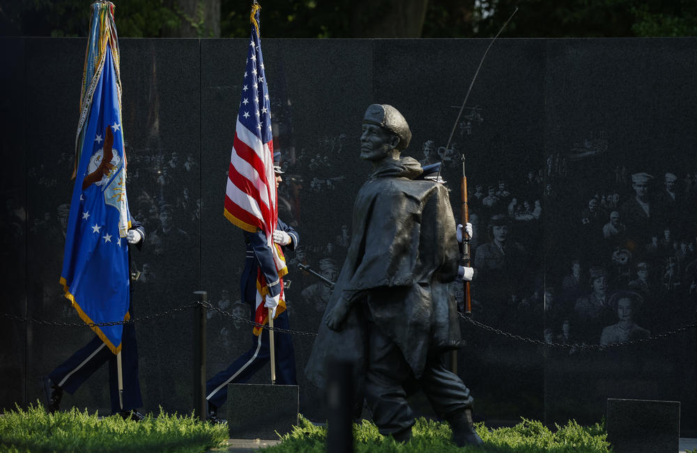Members of the military perform the color guard at a ceremony Thursday at the Korean War Veterans Memorial in Washington, D.C., commemorating the 70th anniversary of the Korean Armistice Agreement.