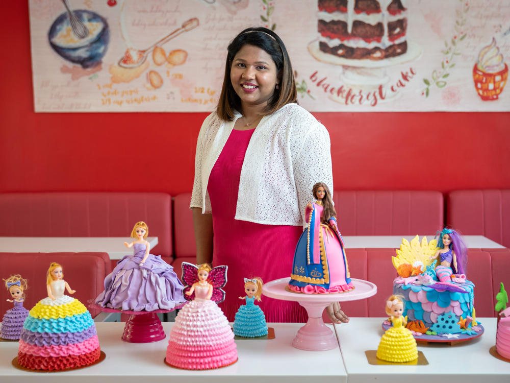 Vichitra Rajasingh had 80 Barbies as a kid. Living in a small town at a time when there wasn't much entertainment, she says Barbie was a source of limitless imagination. At the bakery she now runs, she bakes about half-a-dozen Barbie cakes a week. She says the dolls remind her of her grandmother, who passed away at age 87 in January and who used to surprise her by sewing outfits for her dolls.