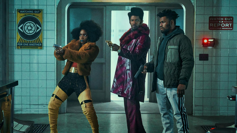 Teyonah Parris as Yo-Yo, Jamie Foxx as Slick Charles and John Boyega as Fontaine in <em>They Cloned Tyrone.</em>