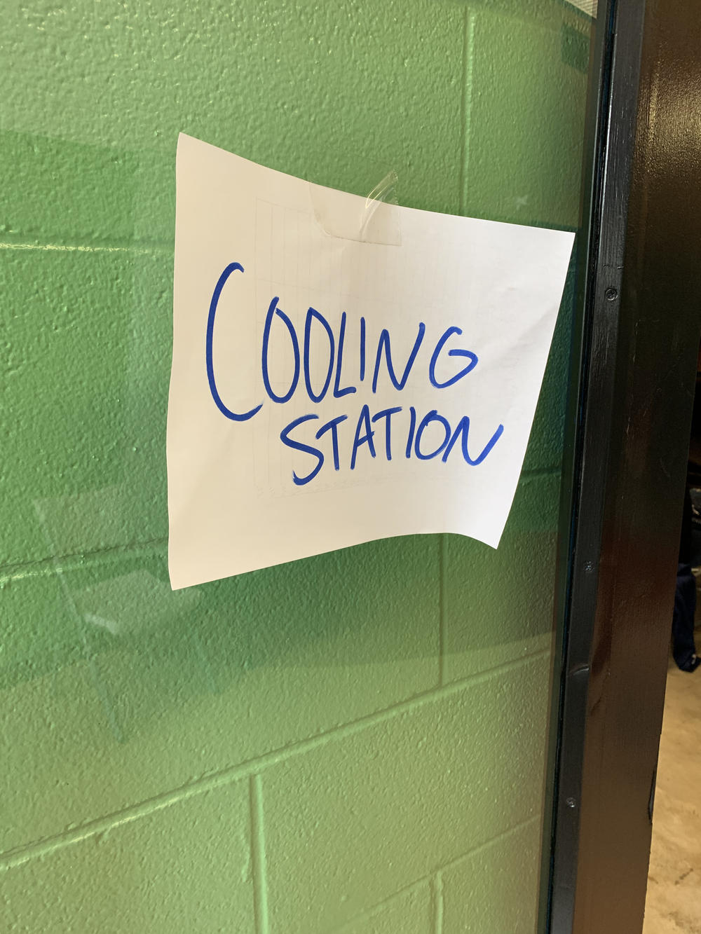 A cooling station sign at the Rosenwald Recreational Center in New Orleans. Recently, heat-related calls to the city's emergency medical services have more than tripled, compared to last summer.