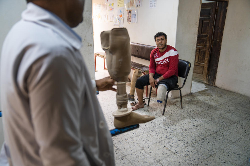 Former soldier Muhammad Fahad Alshaibani waits to test out a new prosthetic being built for him at the center.
