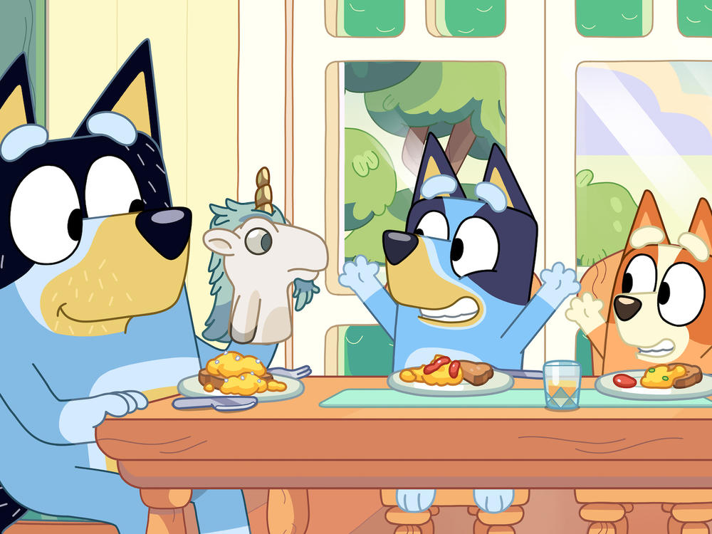 Bandit (left) with his daughters Bluey (center) and Bingo (right).