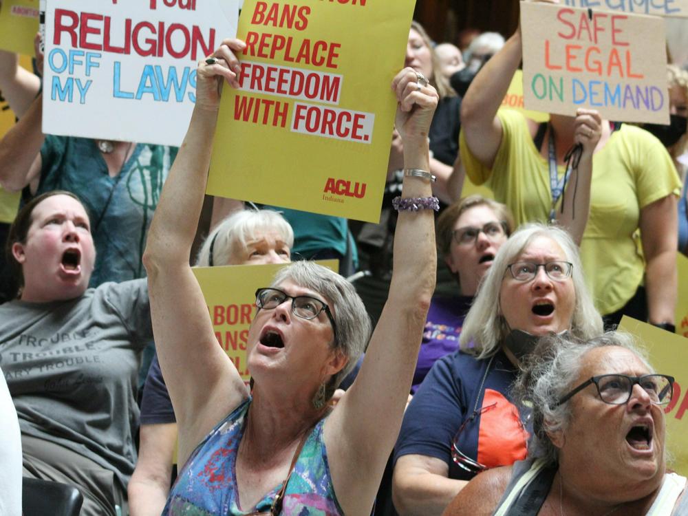 Protestors rallied at the Statehouse in Indianapolis on July 25, 2022, in opposition to a bill to ban abortions in Indiana. After a protracted legal fight lasting almost a year, the state's highest court ruled the ban could go into effect as soon as Aug. 1.