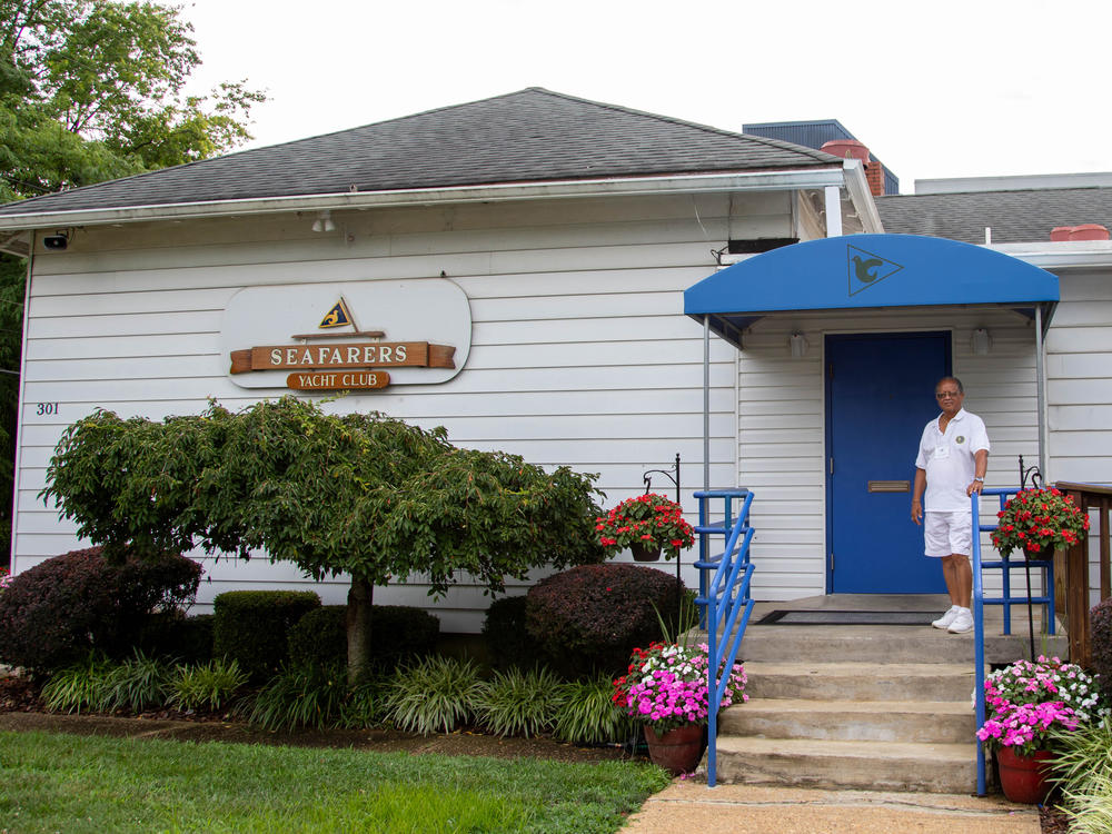 Commodore Benny McCottry stands outside the entrance of the Seafarers Yacht Club of Annapolis in Annapolis, Md. It was founded more than 60 years ago by a handful of Black boaters.