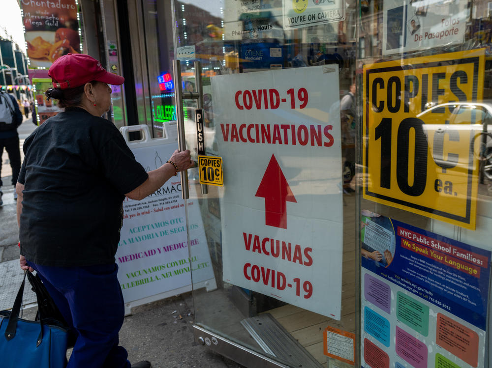 A pharmacy advertises COVID-19 vaccines in New York City.