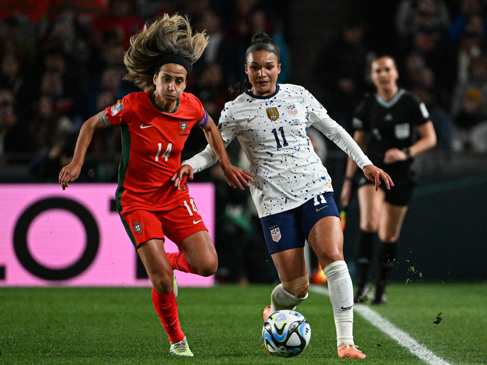 USA forward Sophia Smith (R) fights for the ball with Portugal midfielder Dolores Silva during the 2023 Women's World Cup match in Auckland, New Zealand on August 1, 2023.