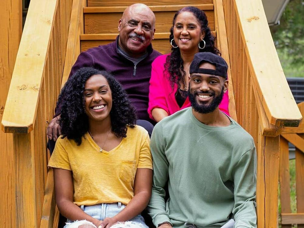 Jeremy Nottingham (bottom right) sits for a family photo with his parents, Junius and Sharon, and sister Briana.