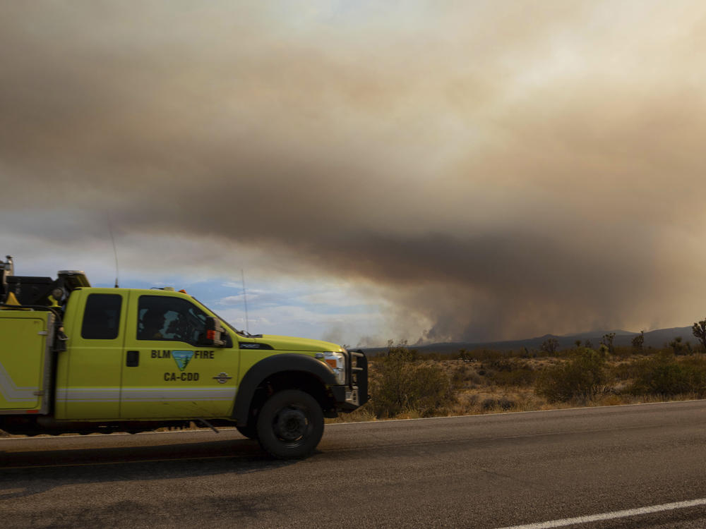 A fire truck heads toward the York Fire on July 30 in the Mojave National Preserve, Calif.