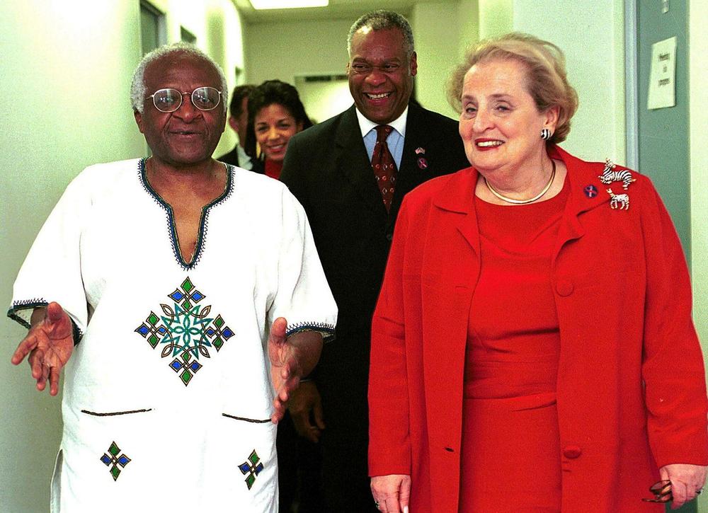 Lewis, center, walks with U.S. Secretary of State Madeleine Albright (right) and Archbishop Desmond Tutu (left) on the way to a private meeting at the offices of the Truth and Reconciliation Commission in Cape Town in 2000.