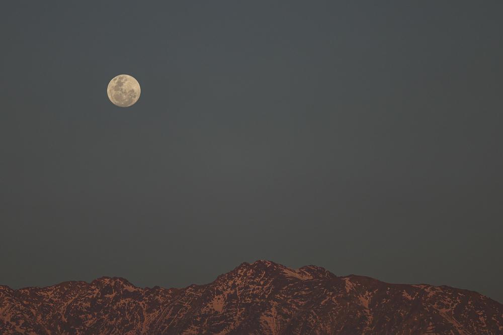 The supermoon rises over the Andes in Santiago, Chile, on Tuesday.