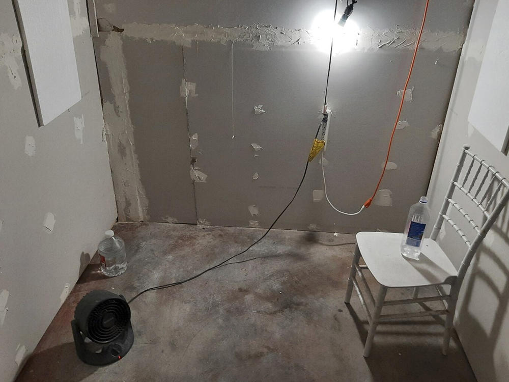 This undated photo provided by the Federal Bureau of Investigation's Portland Field Office shows the interior of a makeshift cinderblock cell in Klamath Falls, Ore., allegedly used as a prison cell from which a woman eventually escaped and found help.