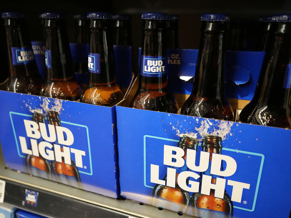 Bud Light's parent company, Anheuser-Busch, says sales and profits dropped in the U.S. between April and June.