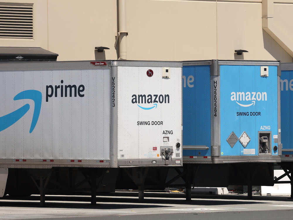 Amazon delivery trucks are parked in Richmond, Calif., on June 21.