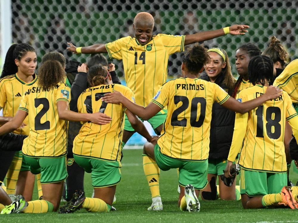 Jamaica celebrates qualifying for the round of 16 after tying Brazil in Melbourne on Wednesday.