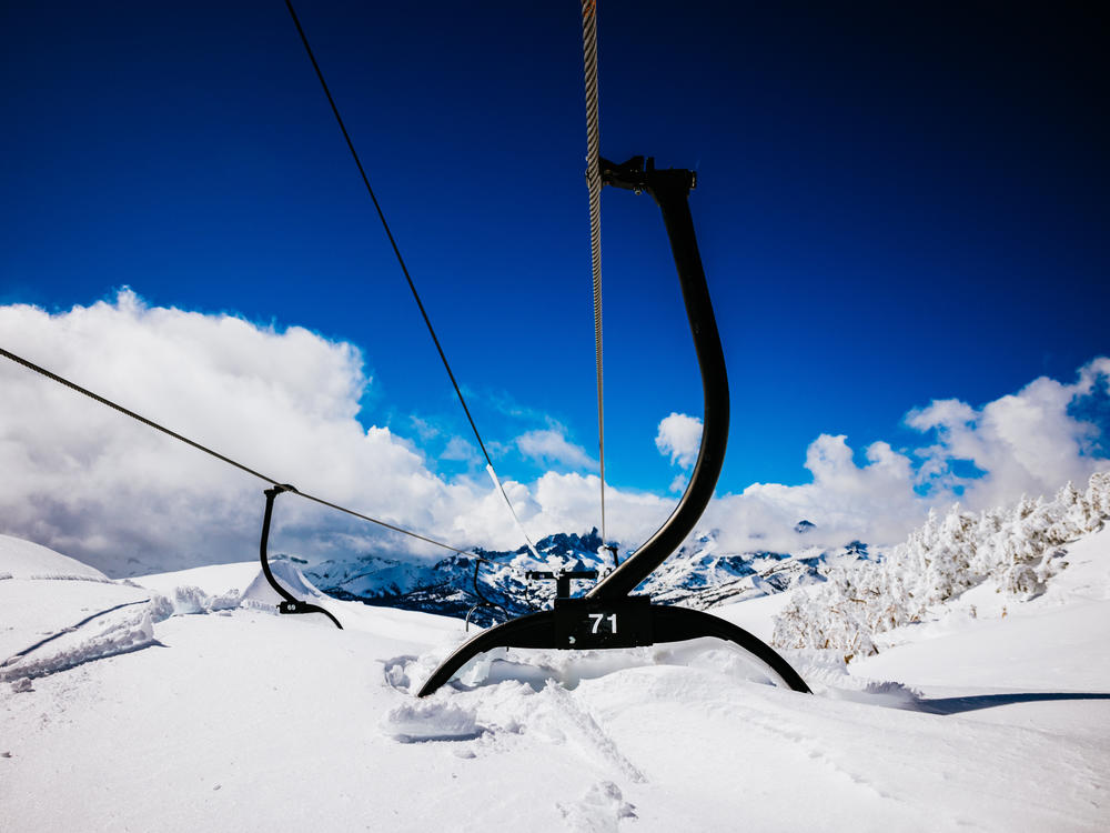A nearly buried chair on a lift at Mammoth Mountain in mid-March. The resort had its snowiest winter on record, having recorded over 700 inches at the base area and nearly 900 inches at the mountain's summit.
