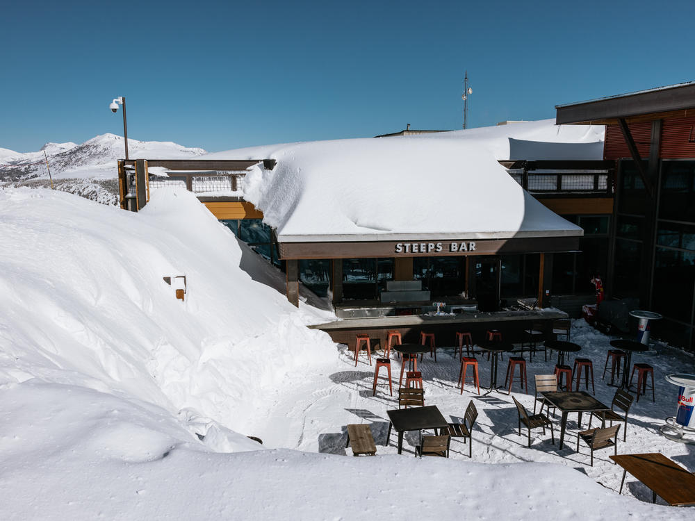 Snowbanks tower over Steeps bar at McCoy Station, Mammoth's mid-mountain gondola stop. The resort received so much snow that some days it was forced to close so staff could try and stay on top of snow removal.