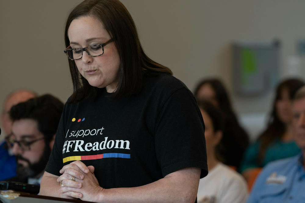 Librarian Amanda Jones speaks out at a Livingston Parish Library Board of Control meeting on July 18, 2023, against a policy that would automatically remove challenged books from library shelves until a review is completed, even if that takes months or more. Jones said that would effectively be a book ban.
