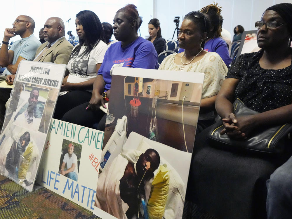 The families of Michael Corey Jenkins and Damien Cameron sit together during the Justice Department's Civil Rights Division tour Thursday, June 1, 2023, in during a Jackson, Miss.