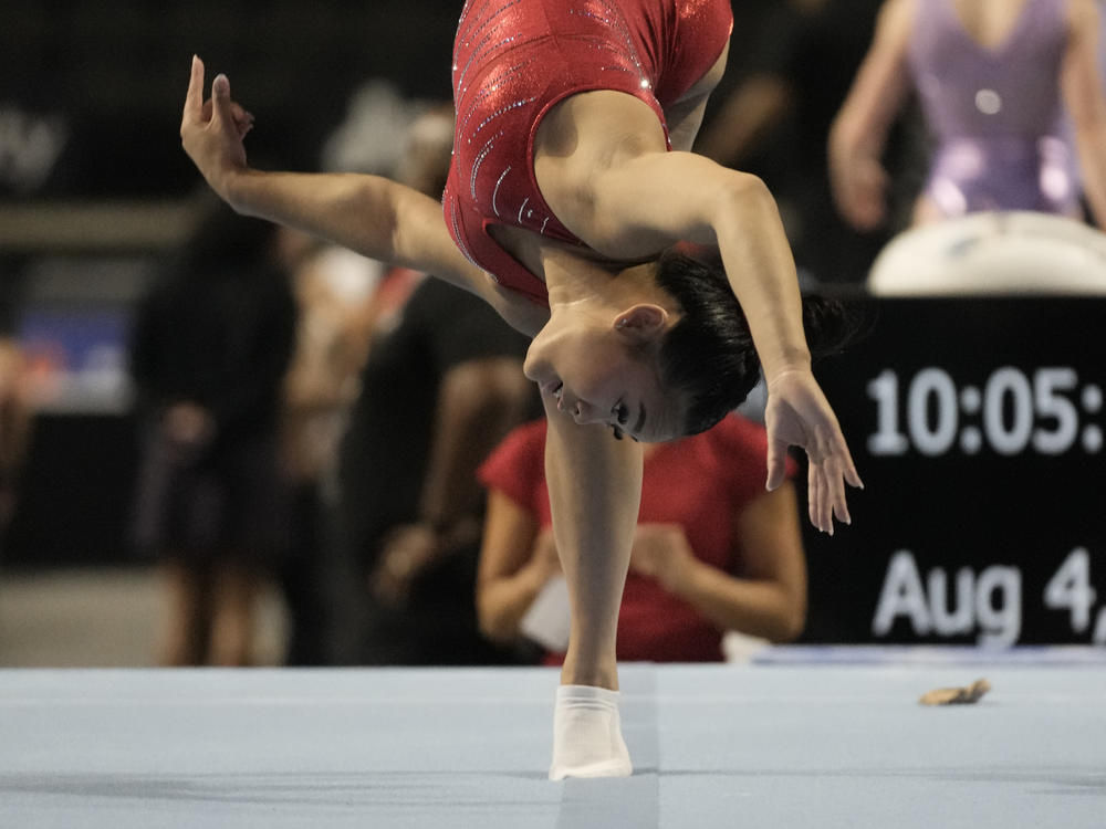 Suni Lee practices on the floor exercise on Friday at the U.S. Classic.