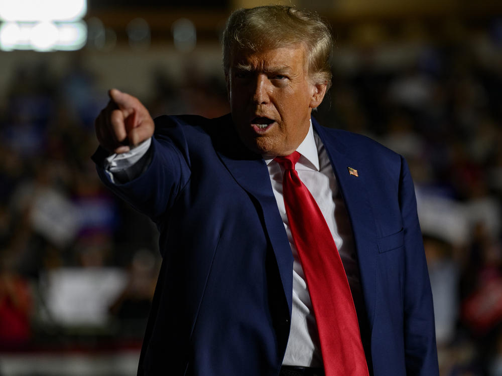 Former President Donald Trump gestures as he enters the Erie Insurance Arena in Erie, Pa., for a political rally while campaigning for the GOP nomination on July 29.