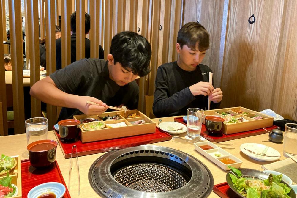 The author's teen sons enjoy fresh lunch during a recent visit to Japan.