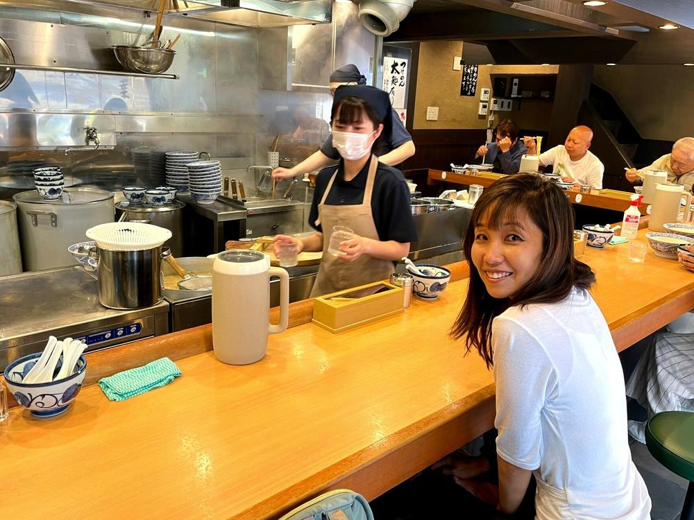 The author awaits a bowl of ramen noodles in a Tokyo restaurant.