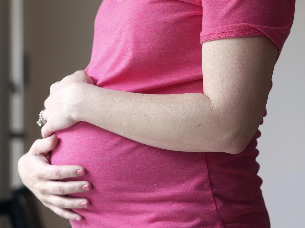 A pregnant woman stands for a portrait in Dallas on May 18. U.S. health officials have approved the first pill specifically intended to treat severe depression after childbirth, a condition that affects thousands of new mothers in the U.S. each year.