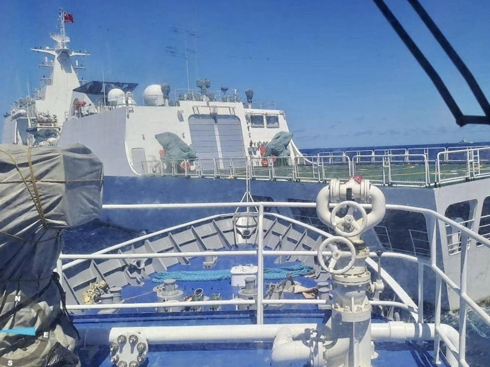 In this photo provided by the Philippine Coast Guard, a Chinese Coastguard ship, front, allegedly blocks the path of a Philippine Coast Guard ship near the Philippine-occupied Second Thomas Shoal, South China Sea during a re-supply mission on Saturday Aug. 5, 2023.